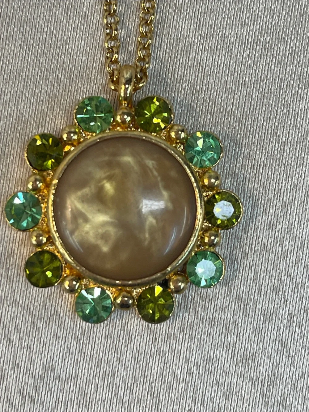 Gold-Tone Necklace with Beige Center and Green Crystal Halo
